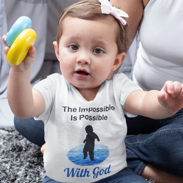Bella+Canvas baby t-shirt with “Impossible Baby” design and faith-filled message, soft cotton, breathable and durable, Christian apparel for infants and family matching, baby girl in white shirt
